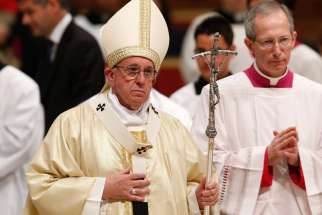 Pope Francis leaves in procession after celebrating Mass marking the feast of Our Lady of Guadalupe in St. Peter&#039;s Basilica at the Vatican Dec. 12. 