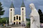 Our Lady of Medjugorje Shrine with St. James Church in the background.