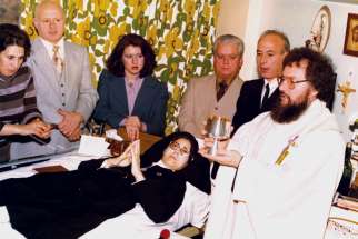 Fr. Claudio Picccinini celebrates Mass in 1977 in the Toronto hospital where Sr. Carmelina Tarantino professed her vows at the first Passionist Sister in Toronto.