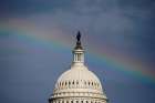 A rainbow shines over the U.S. Capitol in Washington July 24. U.S. Senate voted 51-50 to proceed with health care debate July 25.