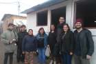  Volunteers from Jesuit-run TECHO-Chile (A Roof for Chile) pose for a photo with community members near a new community center in Rivera Sur camp in Colina, Chile. Young Chileans are discovering that helping others can help them reignite their faith. 