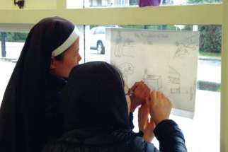 Sisters trace an image during a Catechesis of the Good Shepherd training program. 
