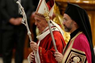 Pope Francis walks with Orthodox Archbishop Job of Telmessos as they leave Mass marking the feast of Sts. Peter and Paul in St. Peter&#039;s Basilica at the Vatican June 29, 2019. Archbishop Job was representing the Ecumenical Patriarchate of Constantinople.