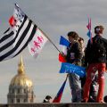 People wave flags at the Esplanade des Invalides as they attend a protest march called &quot;La Manif pour Tous&quot; (Demonstration for All) against France&#039;s legalization of same-sex marriage in Paris May 26. Antoine Renard, president of the Federation of Catholic Family Associations in Europe urged Church leaders not to give up opposition to same-sex marriage.