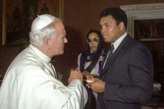 Pope John Paul II meets with Muhammad Ali in 1982 at the Vatican. Ali got his start working at a Louisville Catholic college. He died June 3 at age 74 after a long battle with Parkinson&#039;s.
