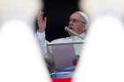 Pope Francis gives a blessing during his Angelus prayer on the feast of the Assumption, Aug. 15, at the Vatican.