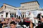 Pope Francis greets the crowd as he arrives to lead his general audience in St. Peter&#039;s Square at the Vatican Sept. 3.