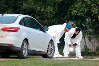 A police forensics team investigates at the site of stabbing spree in Weldon, Sask., Sept. 4. There are at least 11 dead and 18 injured at multiple scenes at James Smith Cree Nation and Weldon.