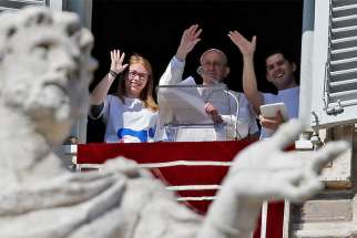 Pope Francis waves after registering for Panama&#039;s World Youth Day 2019 during the Angelus prayer in St. Peter&#039;s Square Feb. 11 at the Vatican.