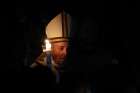 Pope Francis carries a candle in procession as he arrives to celebrate the Easter Vigil in St. Peter&#039;s Basilica at the Vatican April 20, 2019. 