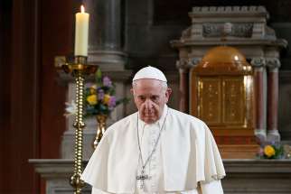  Pope Francis walks in front of a candle in memory of victims of sexual abuse as he visits St. Mary&#039;s Pro-Cathedral in Dublin Aug. 25. Pope Francis apologized for clerical sexual abuse in Ireland but on the final day of the trip, he was accused of ignoring abuse by Cardinal Theodore E. McCarrick.