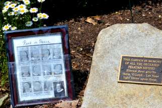 A small memorial for the 12 sisters who died in one month from COVID-19 sits in the garden outside the Felician sisters&#039; convent in Livonia, Mich., June 10, 2020.