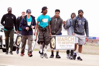  A group of teenagers from Pearl, Miss., walk along U.S. Highway 61 just south of Memphis, Tenn., April 2, on their 50-mile &quot;March to Memphis&quot; tribute to the Rev. Martin Luther King Jr. April 2. April 4 marks the 50th anniversary of the death of the civil rights leader in Memphis.