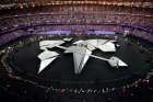 Flag bearers process during the Paris Olympic closing ceremonies Aug. 11.