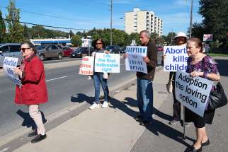 Men and women formed a Life Chain to protest abortion at Yonge and Steeles in Toronto. The annual event is held in more than 1,600 North American cities. 