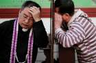  A priest hears confession on Holy Thursday, March 29, at the Cathedral of the Immaculate Conception in Beijing. For the first time in decades, all of the Catholic bishops in China are in full communion with the Pope, the Vatican announced Sept. 22. 