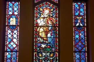 In one of the stained glass windows at Our Lady of Peace Church in Toronto, Mary is being taught about God’s Torah by her mother St. Anne.