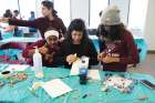 Twelve-year-old Kisanet, left, joins in at Silent Voice’s Saturday program for deaf children.