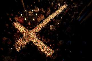 Orthodox faithful in Bulgaria light candles with jars of honey Feb. 10. Pope Francis says the &quot;crucifix is not a decoration&quot; but that redemption is possible because Jesus took on the sins of the world. 