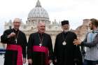 Seamus McKelvey of Winnipeg, Manitoba, crashes a group photo with Canadian bishops in front of St. Peter&#039;s Basilica March 27. From left are Archbishops Richard Smith of Edmonton, Alberta; Richard Gagnon of Winnipeg, Manitoba; and Bishop Kenneth Nowakowski of the Ukrainian Diocese of New Westminster, British Columbia. The bishops were making their &quot;ad limina&quot; visits to the Vatican to report on the status of their dioceses.