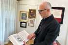 Bishop Joseph reflecting with the Holy Bible given to him by Mr. Harvey Satewas Gabriel