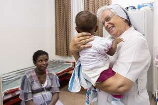Sr. Laura Girotto takes care of a child in the hospital she was instrumental in building in an area with an illiterate population that was devastated by the mid-1980s famine, and where young mothers — some as young as 12 — were ignorant of basic baby care, which led to far too many deaths. 