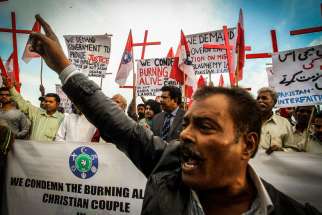 Pakistanis protest Christian couple burned alive for alleged blasphemy in Islamabad, Pakistan Nov. 14, 2014. The U.S. bishops are calling on people of all faiths to pray for those facing religious persecution in the Middle East and elsewhere. 