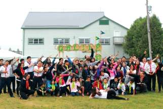 Members of the Vietnamese Eucharistic Youth Movement clown around at this year’s annual summer camp. 