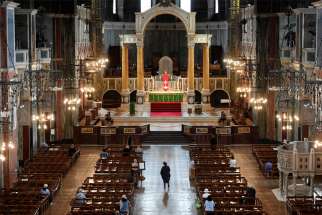 People are pictured in mid-June praying at London&#039;s Westminster Cathedral. In a private ceremony, British Prime Minister Boris Johnson and his fiancee, Carrie Symonds, had their 4-month-old son baptized Sept. 12 in the cathedral&#039;s Lady Chapel.