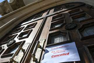 The pandemic has resulted in unfamiliar signs posted on church doors.