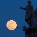 A full moon is juxtaposed with statues of saints on the colonnade in St. Peter’s Square at the Vatican. A formula has been devised using a full moon to pinpoint the date of Easter, but still we don’t have a firm date that Roman Catholics and Orthodox can agree upon.