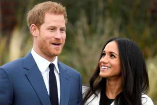 Britain&#039;s Prince Harry poses with Meghan Markle Nov. 27 in the Sunken Garden of Kensington Palace in London after announcing their engagement. Markle attended Immaculate Heart High School in Los Angeles. 