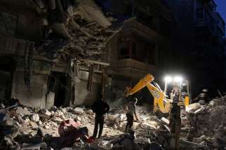 Civil Defence members search for survivors Sept. 27 at a site hit by an airstrike in the rebel-held al-Shaar neighborhood of Aleppo, Syria. Pope Francis said Sept. 29 that logic of weapons and hidden interests continues to devastate Middle Eastern countries in conflict.