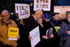  Peter Isely hugs Becky Ianny as protesters gather outside the hotel in Baltimore where the U.S. Conference of Catholic Bishops was meeting during its fall general assembly. 