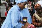 A nun prays outside a Catholic church in Lagos, Nigeria, April 3, during a re-enactment of Jesus&#039; passion and crucifixion as part of Holy Week celebrations. 