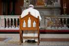 Pope Francis prays in front of a candle in memory of victims of sexual abuse as he visits St. Mary&#039;s Pro-Cathedral in Dublin Aug. 25, 2018. Pope Francis has revised and clarified norms and procedures for holding bishops and religious superiors accountable in protecting minors as well as in protecting members of religious orders and seminarians from abuse. 