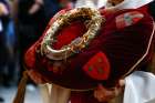 A knight of the Equestrian Order of the Holy Sepulchre holds the crown of thorns during a procession marking its return to Notre Dame Cathedral in Paris Dec. 13, 2024, five-and-a-half years after a fire ravaged the Gothic Parisian landmark.