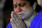 A family member of victims cries while praying during the reopening ceremony of St. Anthony&#039;s Shrine in Colombo, Sri Lanka, June 12, 2019, months after it was closed because of an Easter bombing.