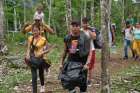 A group of Venezuelan migrants begins the trek through the Darién Gap April 30, 2023, as they leave the Colombian village of Capurgana. Catholic groups working with migrants traversing the treacherous Darién Gap expressed skepticism over a July 1, 2024, joint U.S.-Panama plan to deport people who are coming through the jungle, which straddles Colombia and Panama, and heading to the U.S. border.