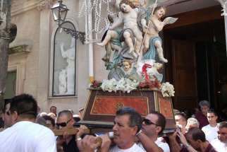 Townspeople of Mammola, Italy, carry the relics of San Nicodemo in a procession to the town’s former Basilian abbey.