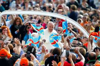 Pope Francis greets pilgrims as he arrives for his weekly audience Sept. 21 in St. Peter&#039;s Square at the Vatican. The Pope will be visiting the countries of Georgia and Azerbaijan between Sept. 30–Oct. 2, focusing on the themes of peace and reconciliation.
