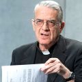 Jesuit Father Federico Lombardi, Vatican spokesman, turns pages of a press bulletin concerning Paolo Gabriele during its release to media at the Vatican Aug. 13