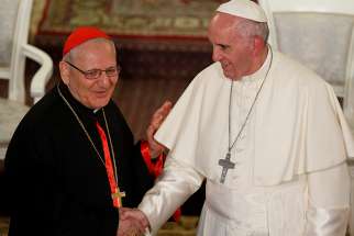 Pope Francis greets Chaldean Catholic Patriarch Louis Sako of Baghdad, Iraq, during a meeting with Chaldean Catholics at the Church of St. Simon the Tanner in Tbilisi, Georgia, in this Sept. 30, 2016, file photo.