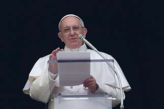  Pope Francis speaks as he leads the Angelus from the window of his apartment overlooking St. Peter&#039;s Square at the Vatican Dec. 11. In an annual tradition, Roman children brought their figurines of the baby Jesus to the Angelus.