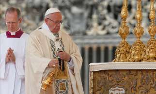 Pope Francis uses incense as he celebrates the canonization Mass for two new saints in St. Peter&#039;s Square at the Vatican June 5.