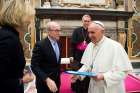 Pope Francis talks with Nancy Gibbs, editorial director of Time Inc. News Group, and Alan Murray, editor-in-chief of Fortune, during an audience with business leaders at the Vatican Dec. 3. The business leaders were taking part in the Fortune-Time Global Forum in Rome.