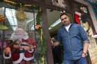 Palestinian Catholic Walid Abu Ayash, 39, tattoo artist, stands at the entrance to his barbershop/tattoo parlor Dec. 5 in Bethlehem, West Bank.