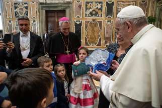 Pope Francis accepts a gift during an audience with members of the Italian Association of Organ Donors at the Vatican April 13, 2019. The pope said that when done ethically and free of charge, organ donation is a selfless gesture.