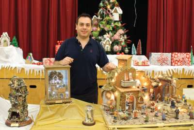 Francesco Ferrigno, who arrived in Canada from Italy four years ago, is surrounded by the Nativity scenes he created that are on display at St. Eugene Catholic School.