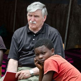 Senator Roméo Dallaire with Bwira Kapoto, a former child soldier, at the UN transit camp for ex-combatants in Goma, Congo.